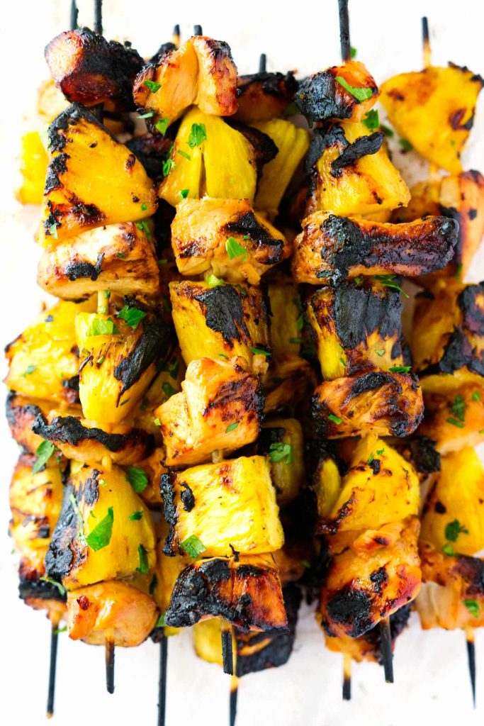 These Hawaiian Chicken and Pineapple Kabobs take chicken and pineapple to the next level. The Hawaiian marinade on the chicken and the brown sugar on the grilled pineapple are a surefire way to make a delicious meal in less than 10ish minutes cooking time! 