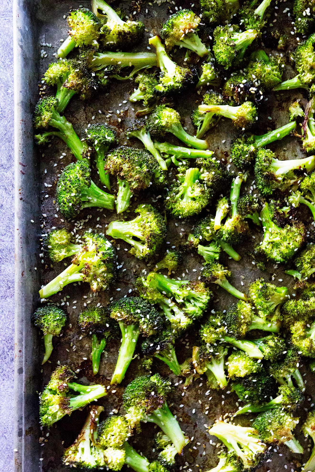 Simple roasted Asian broccoli is where it's at. Broccoli is simply roasted with an Asian flair and it's epic.