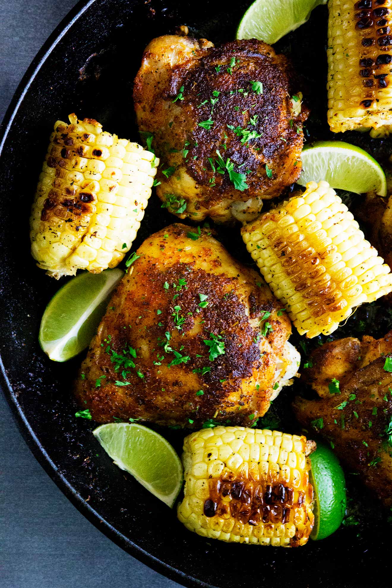 The flavors of the Bayou come alive in these Bayou Cajun Chicken Thighs. Loaded with flavor this easy meal is topped with corn and lime juice and is absolutely tasty!