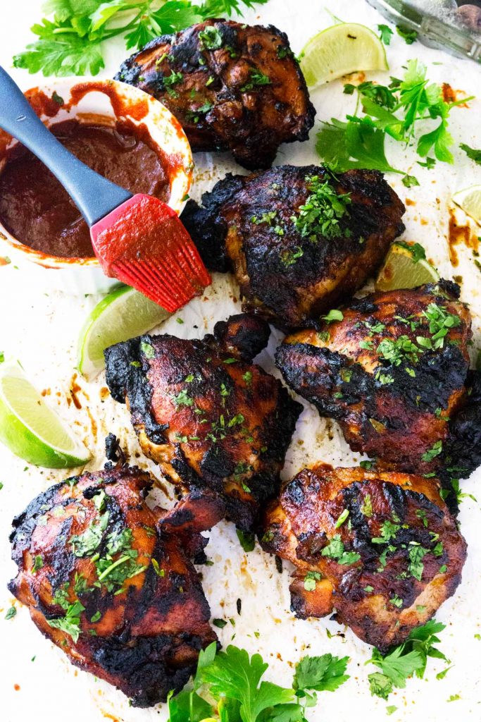 These Sriracha grilled chicken thighs with honey and lime are an absolute hit! They have a little zip, a little tang, and a bit of sweetness all grilled to perfection. Great for any home bbq or a delish home cooked meal.Â