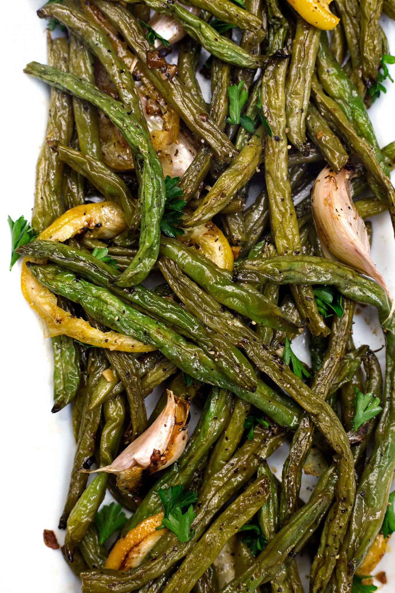 These roasted green beans with lemon and garlic are super-easy to make, down right delicious, full of flavor, and have only four ingredients. Now that’s winning at life!