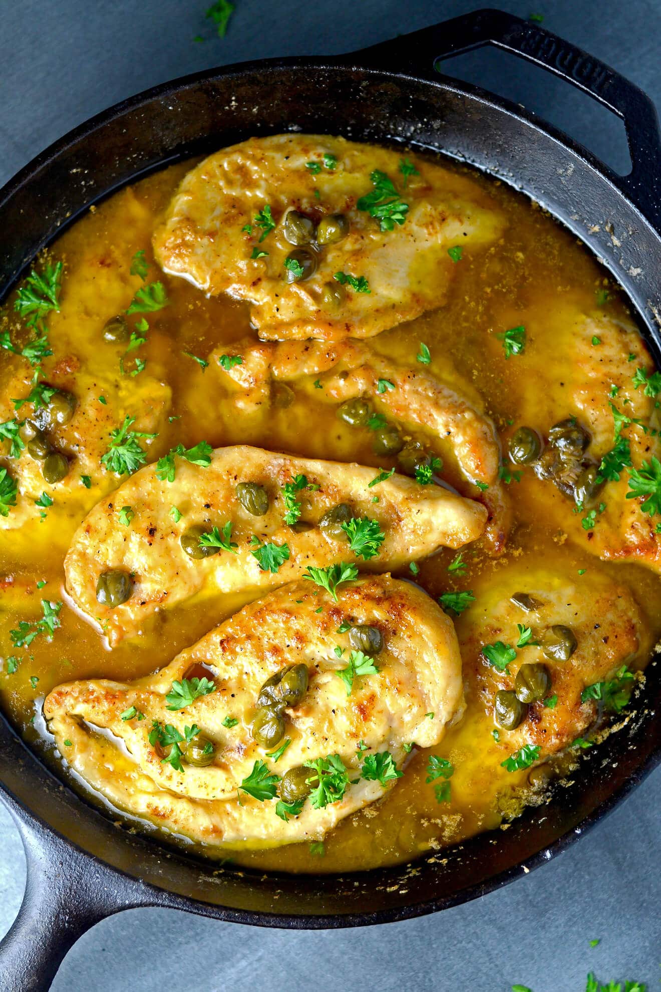 Chicken Piccata Recipe- A chicken dish that is sautéed in butter and olive oil then served in a sauce with capers, lemon juice, butter, olive oil, and chicken stock.