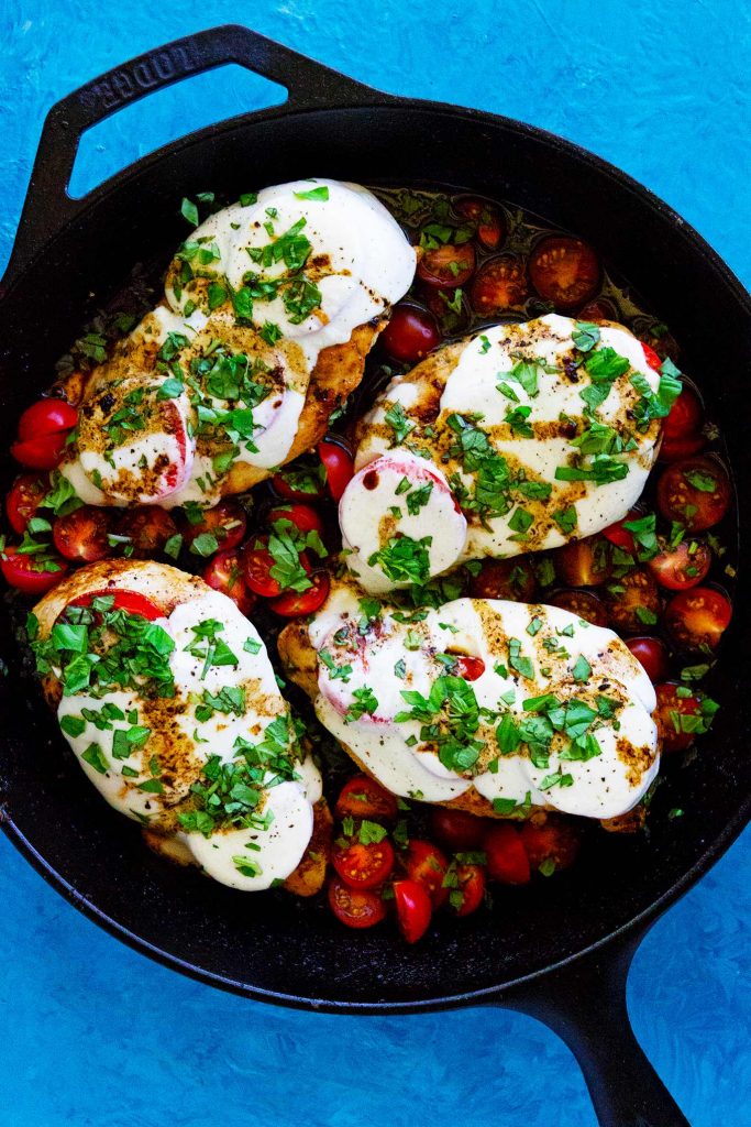 This caprese chicken with balsamic glaze takes less than 30 min to make, is made in one skillet, and tastes so dang delish. Great for a tasty and quick dinner!