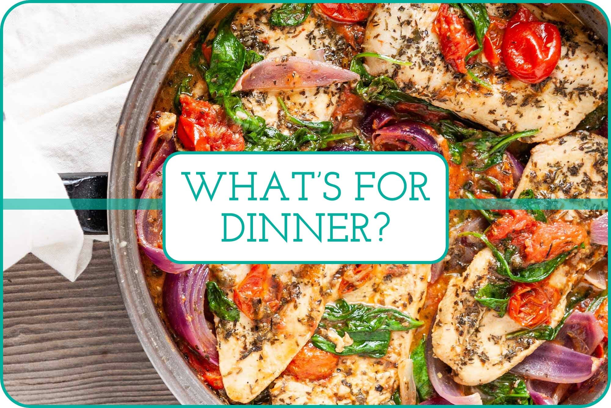 Skillet of chicken breast, tomatoes, spinach, and red onion with a white towel around the handle and a text over the image that says what's for dinner?