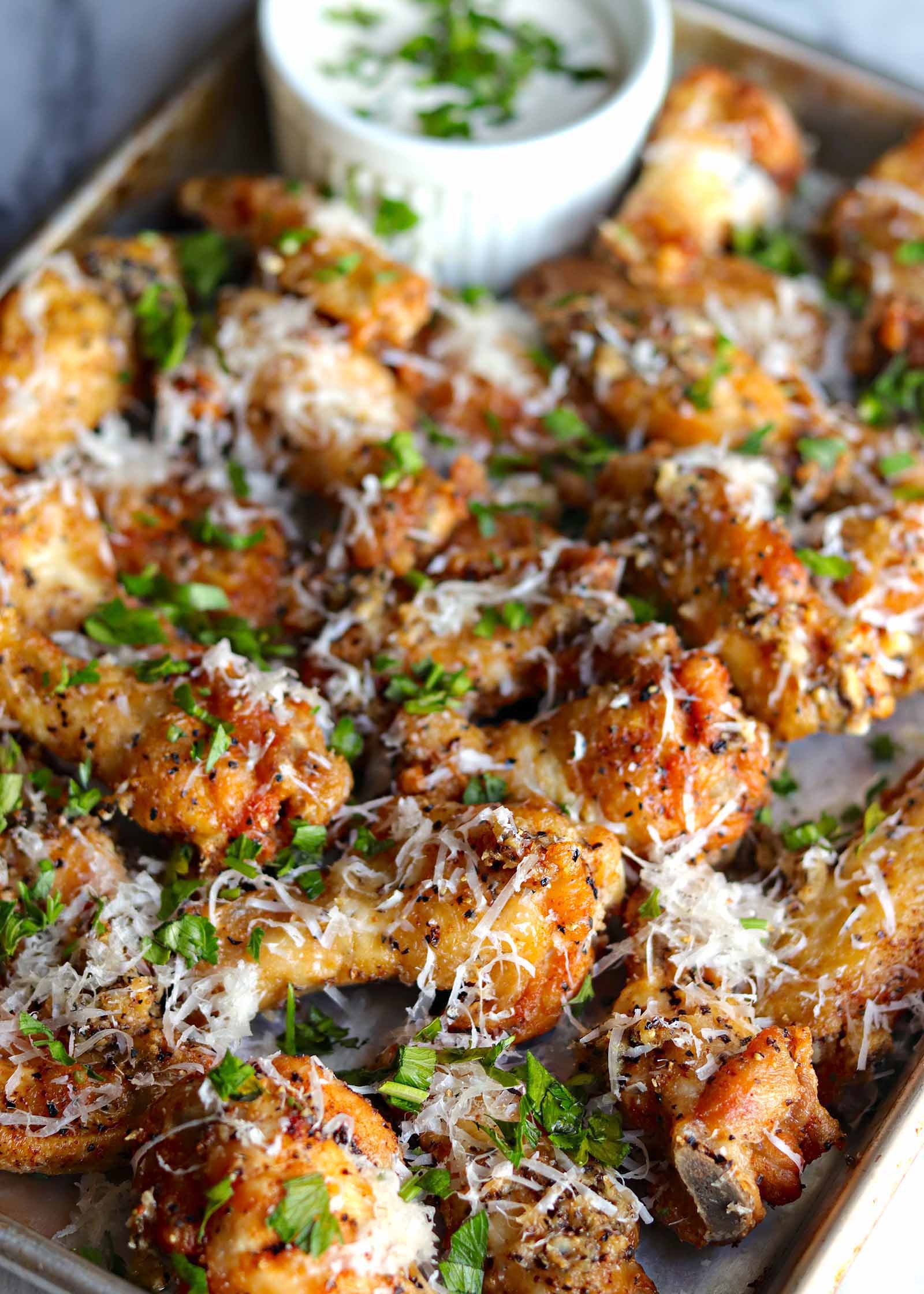 Platter of salt and pepper fried chicken wings with blue cheese dressing