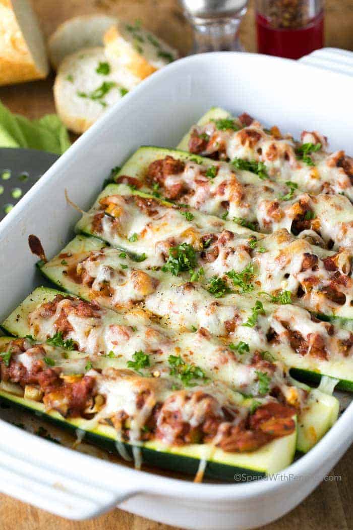 Stuffed Zucchini Boats in dish with parsley