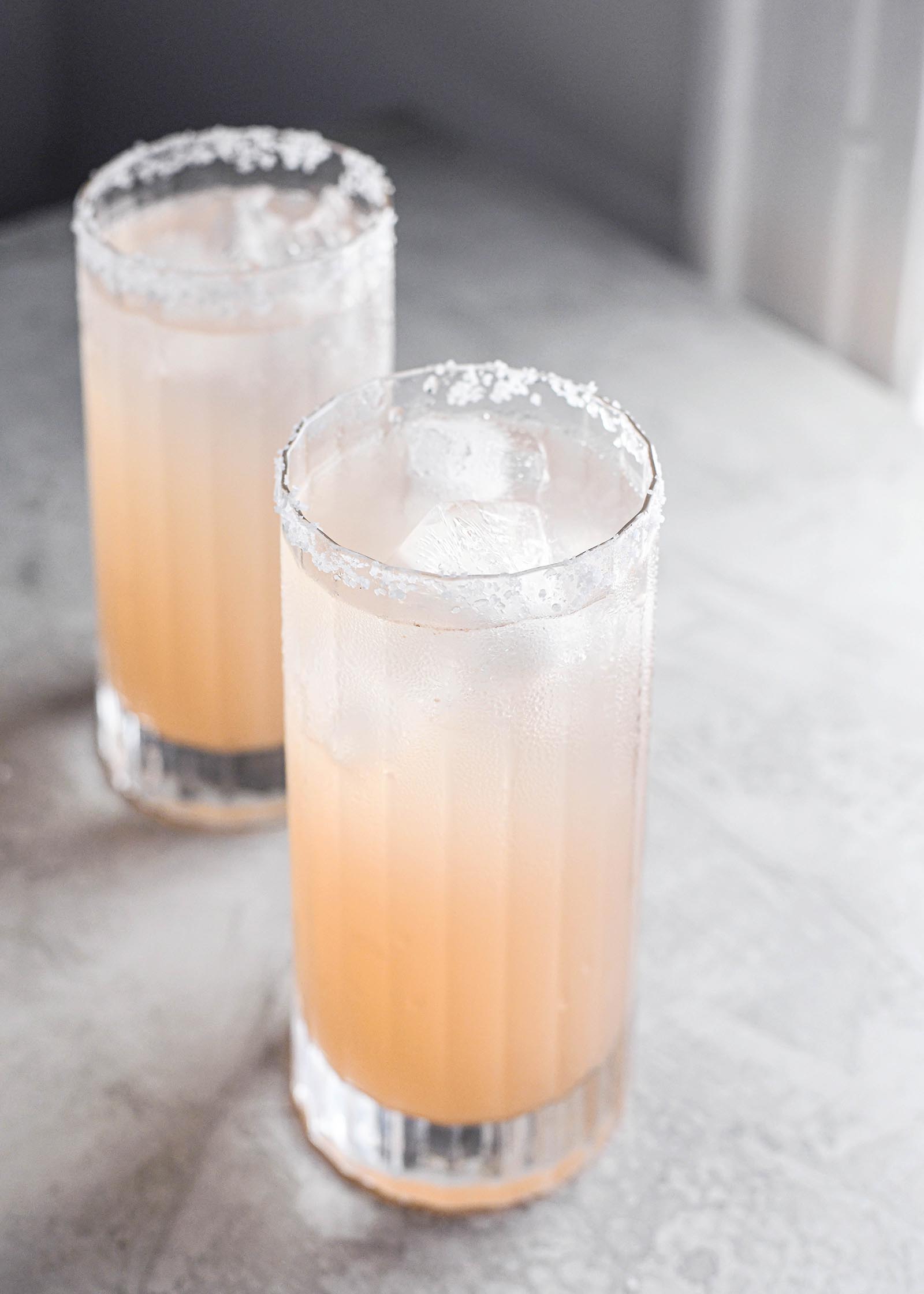 What is a Salty Dog? tall glasses cocktail with grapefruit and salt