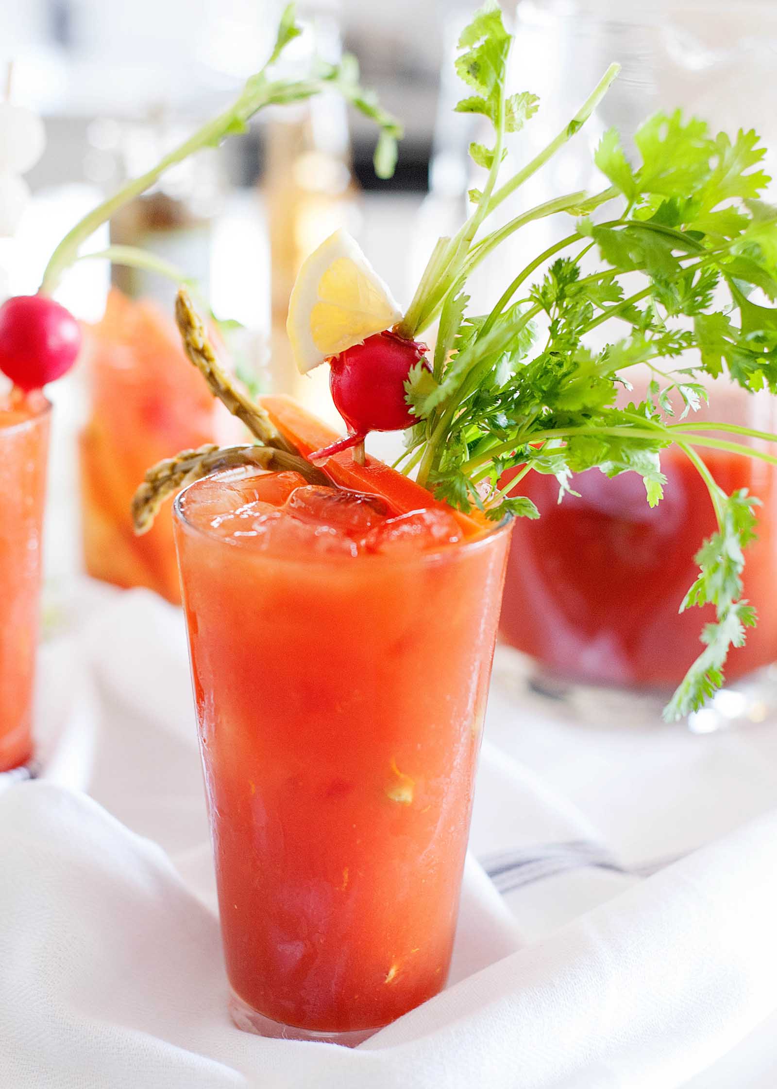 What Is a Bloody Maria? - orange red breakfast cocktail with veggies garnish