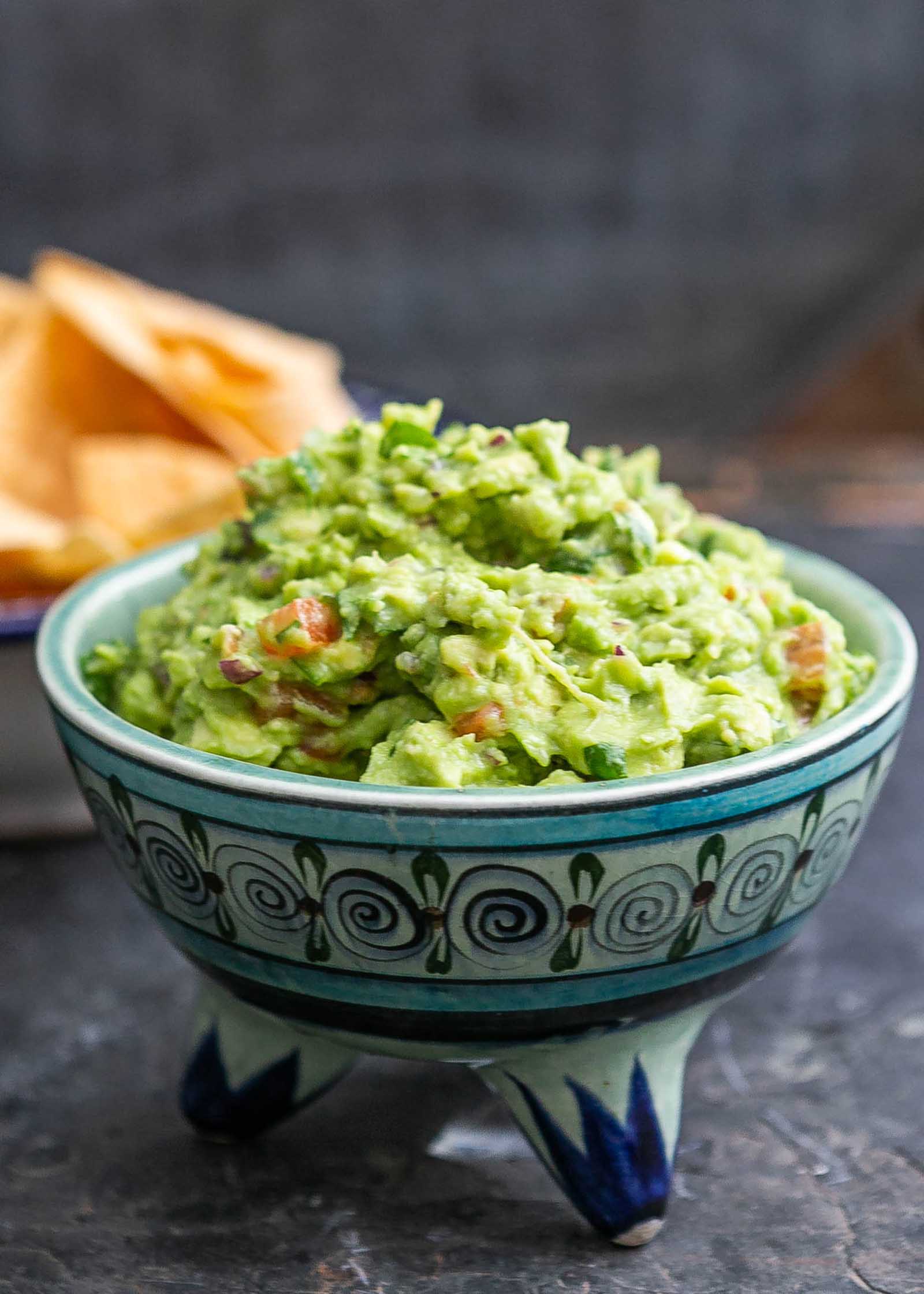 Easy guacamole served in a traditional mexican bowl