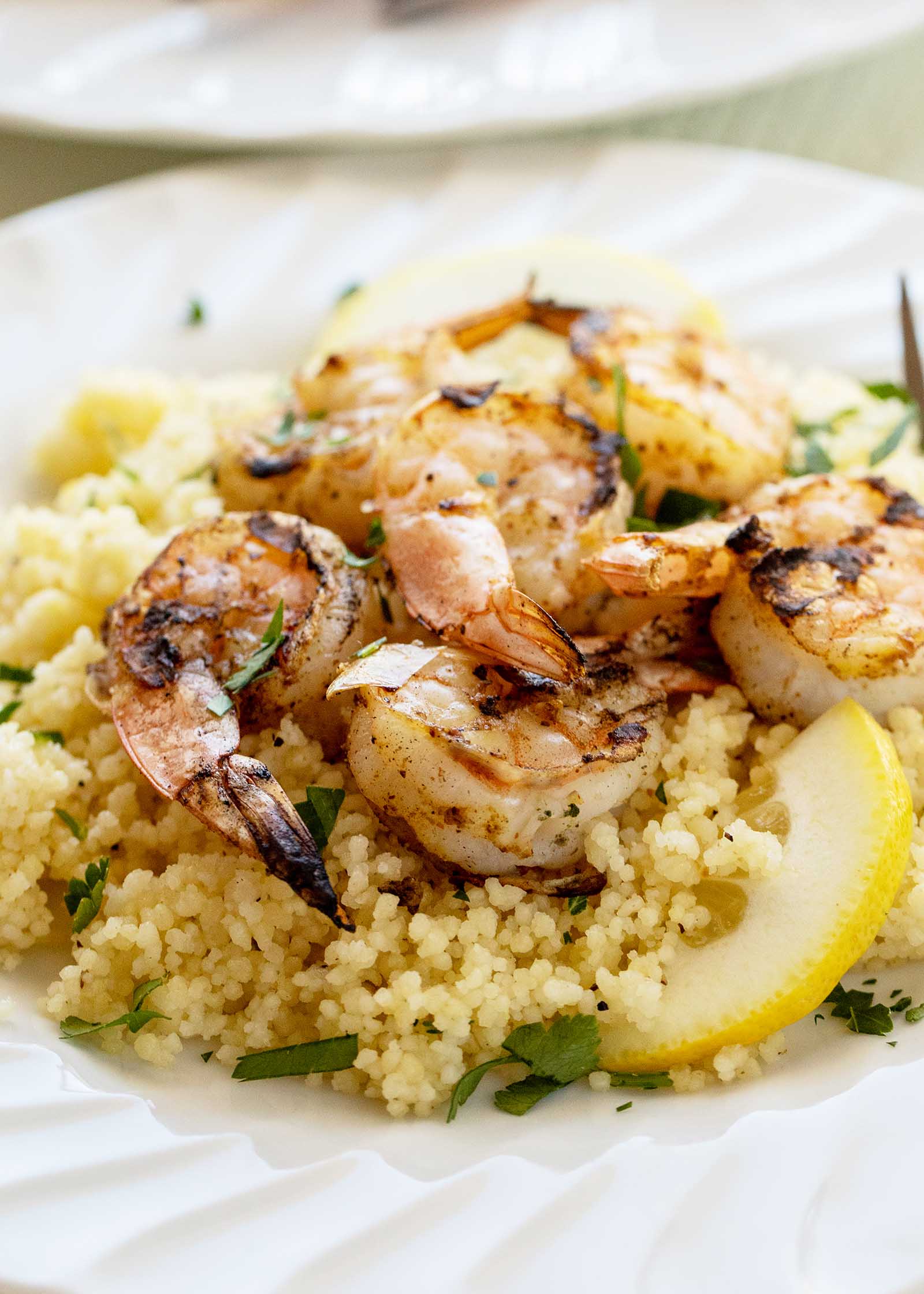 Quick and easy grilled shrimp set over couscous with lemon and pepper.