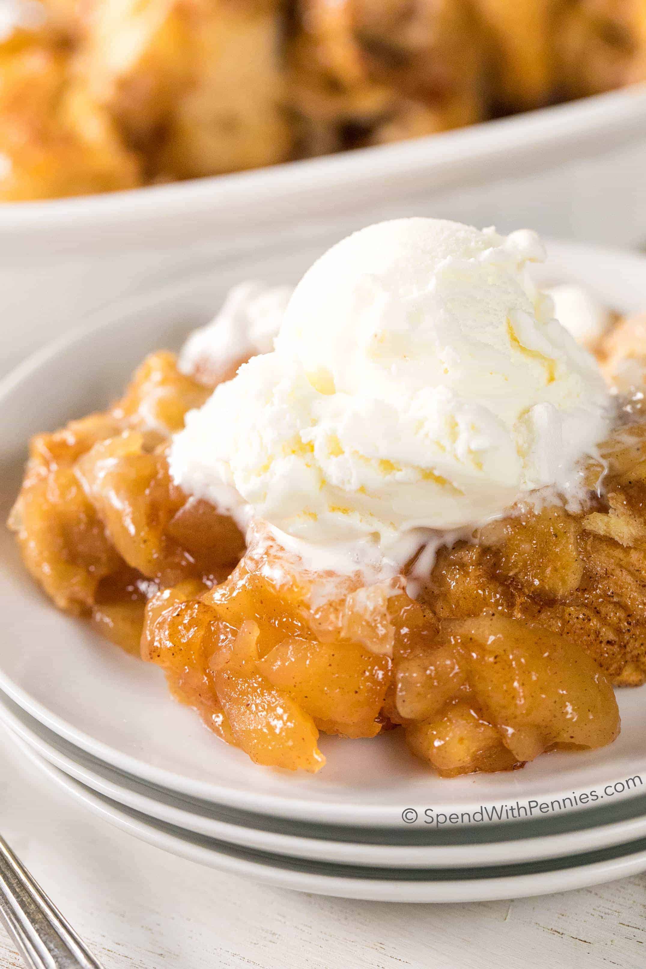 2 Ingredient Apple Pie Dumplings on a plate with ice cream