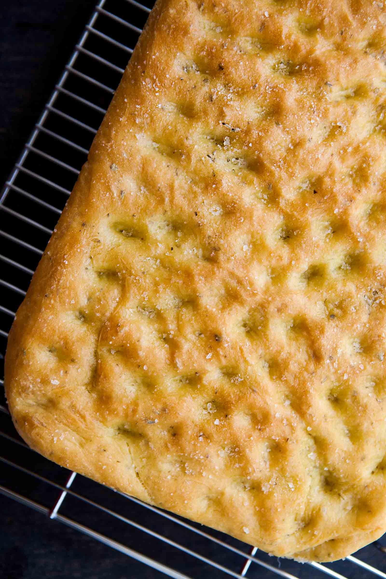 Crispy Rosemary Focaccia just out of the pan and cooling on a rack