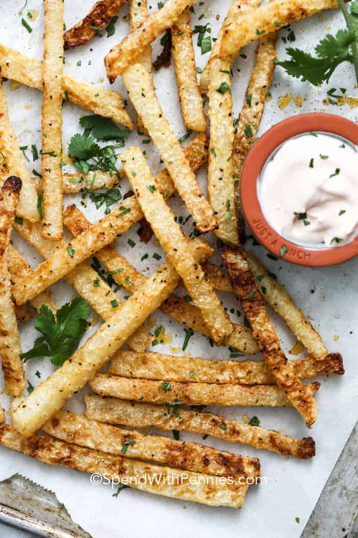 Jicama Fries on a sheet pan with parsley