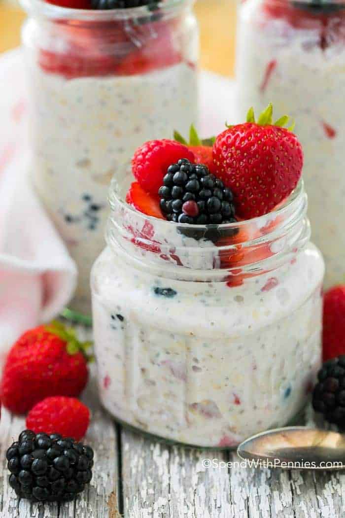 Refrigerator Oatmeal in a glass jar with berries on top