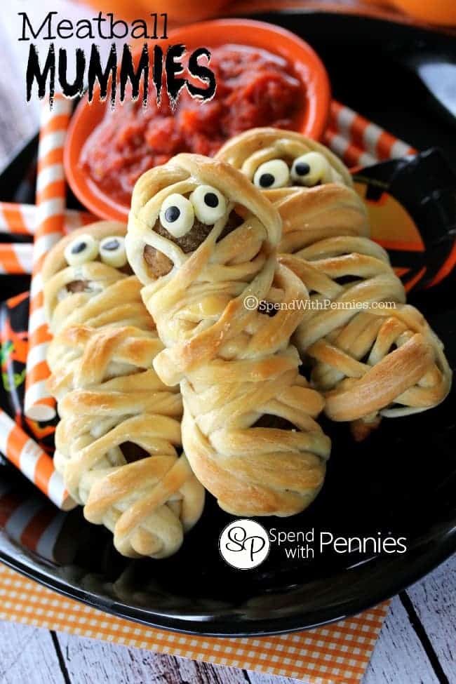 a plate of meatball mummies with marinara