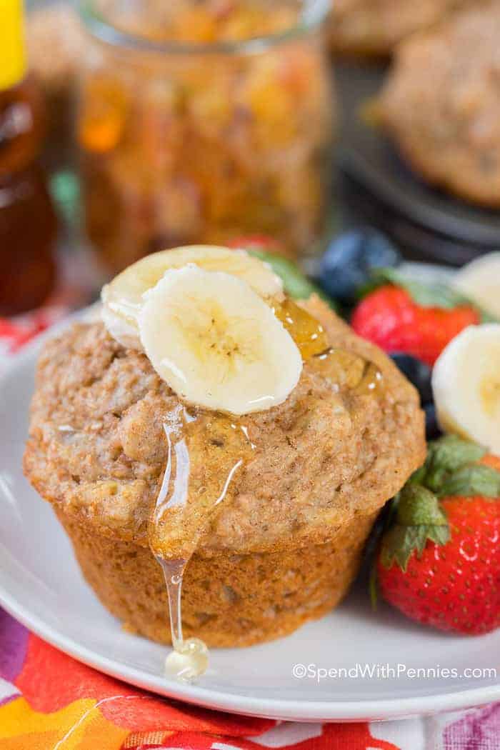 Bran muffin drizzled with honey and topped with banana slices