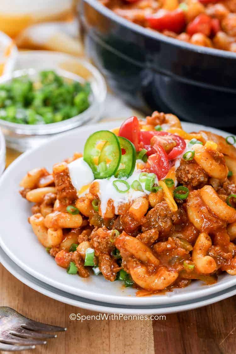 Taco Pasta Skillet on a plate with sour cream and jalapenos