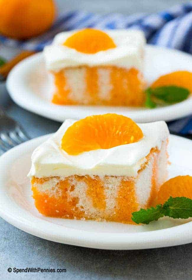 two plates of orange creamsicle poke cake
