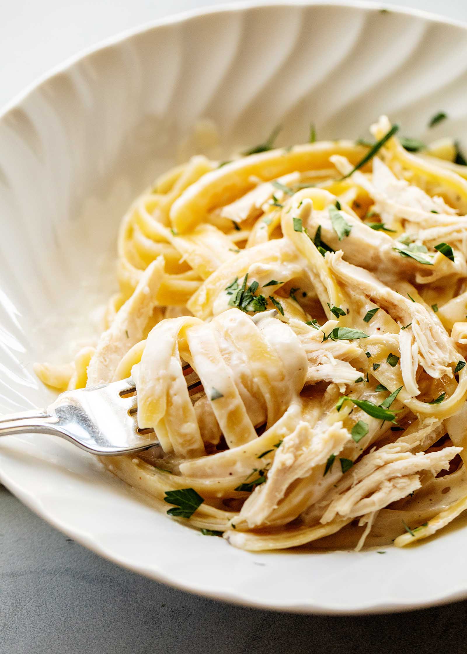 rotisserie chicken alfredo in a bowl
