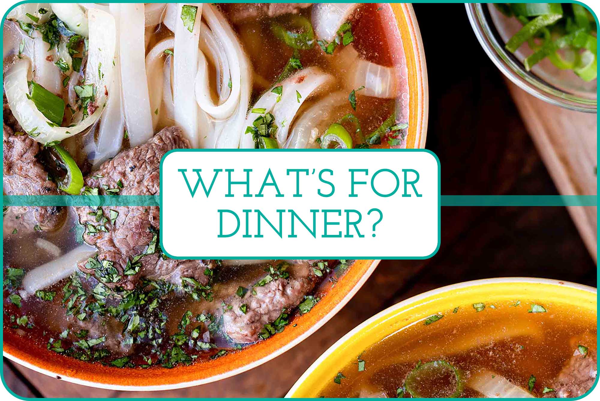 Close up of beef Pho in an orange bowl with a second yellow bowl nearby.