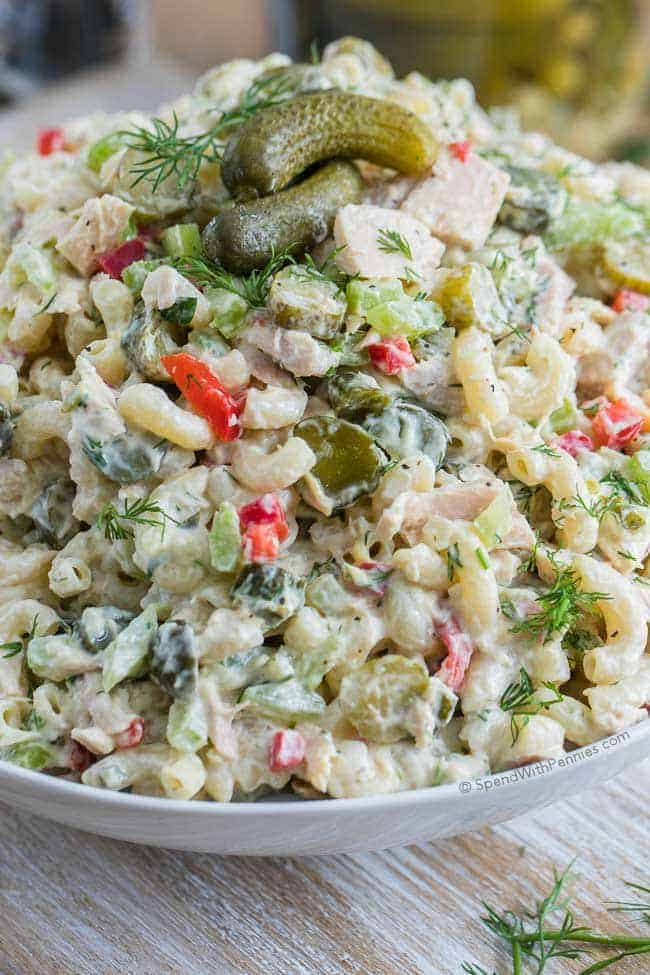 Pickled Tuna Macaroni Salad in a serving bowl topped with pickles