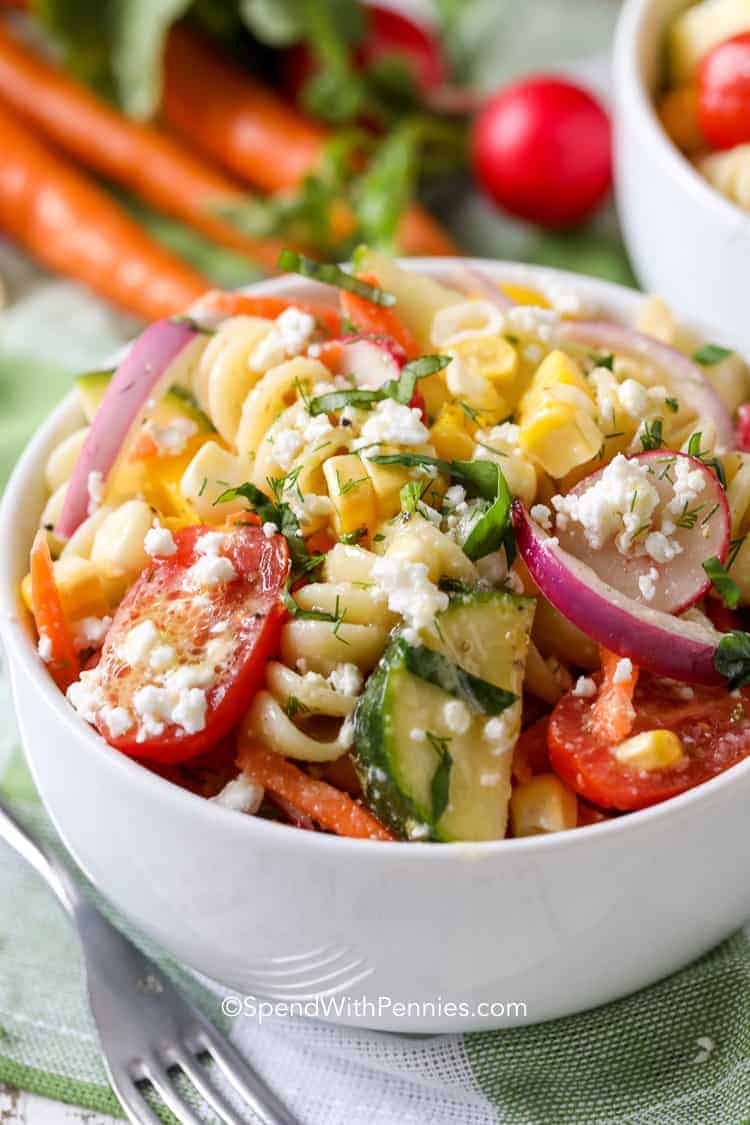 Summer Pasta Salad in a white bowl with a fork