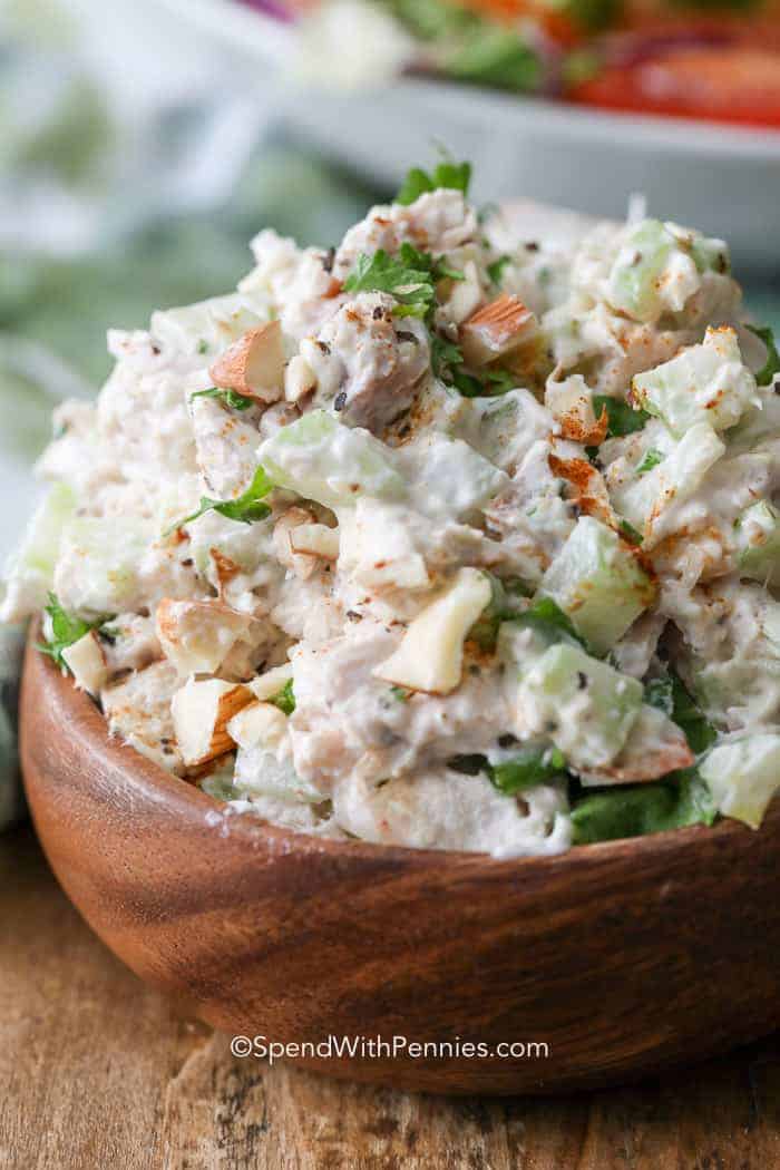 Wooden bowl with chicken salad in it