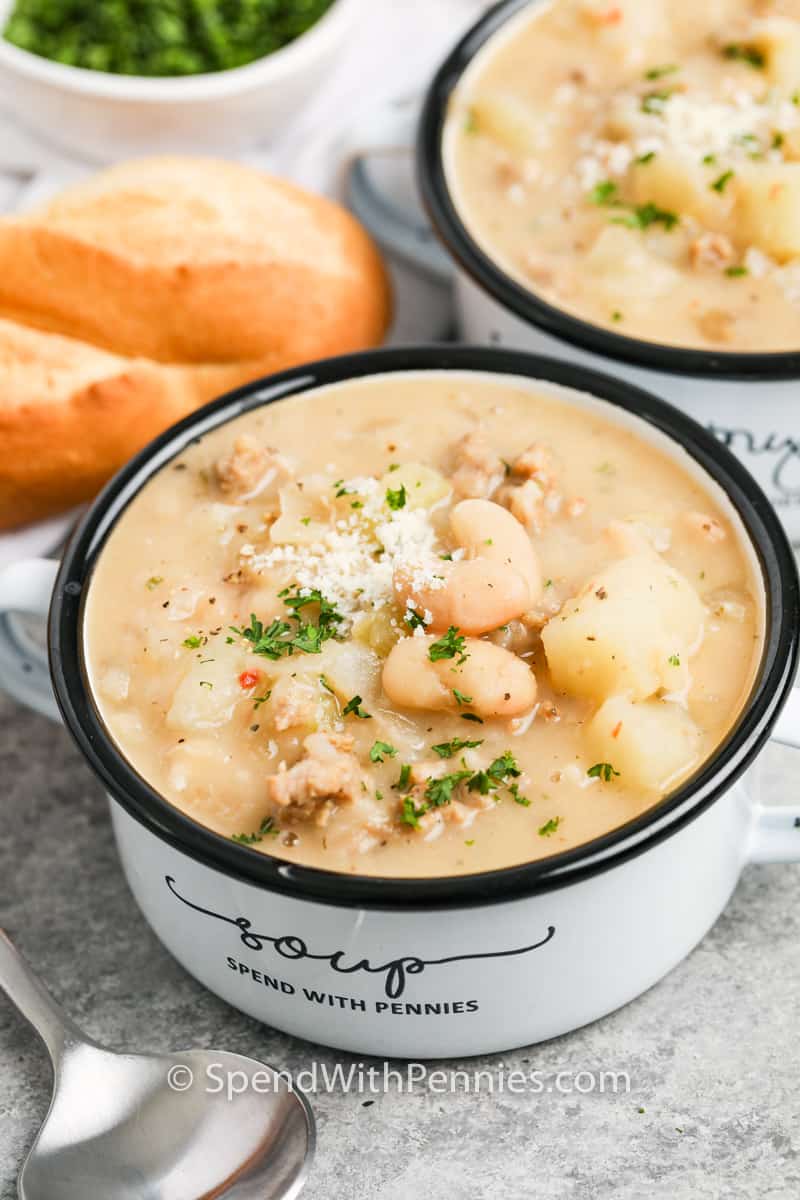 Creamy Cannellini Soup in a bowl garnished with parmesan cheese and parsley.