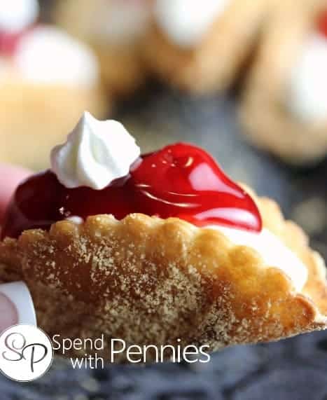 a whole Cheesecake Dessert Tacos with cherry filling