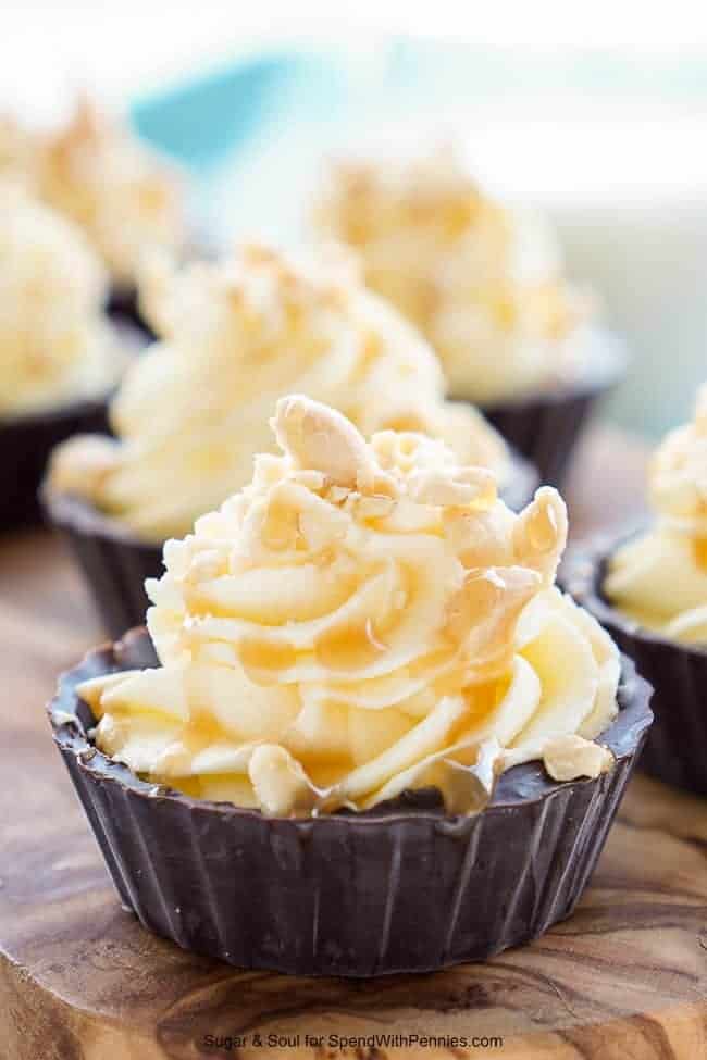 Closeup of Bite-Sized Snickers Cream Pies on a cutting board