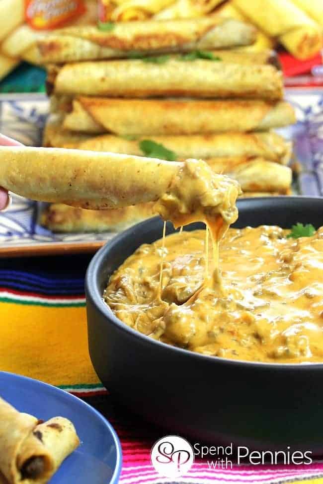 Cheesy Taquito Beef Queso Dip served in a black dish