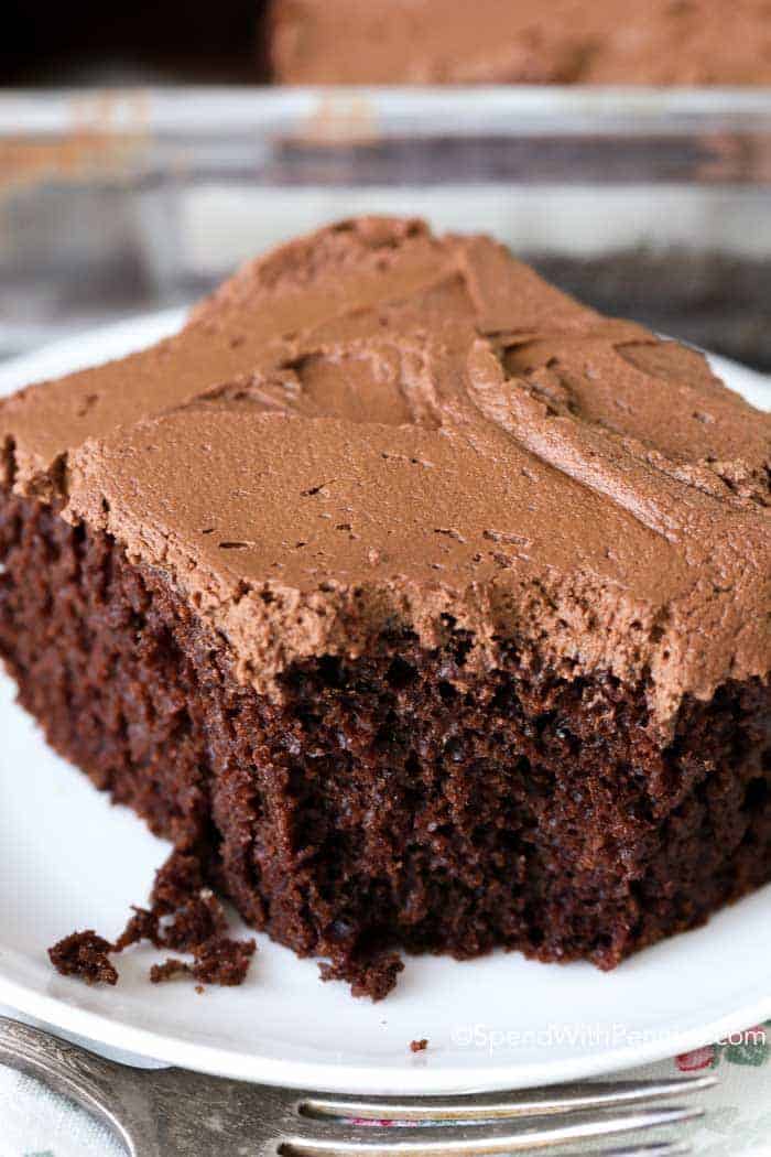 Piece of Chocolate Mayonnaise Cake on a white plate with a bite taken out of it