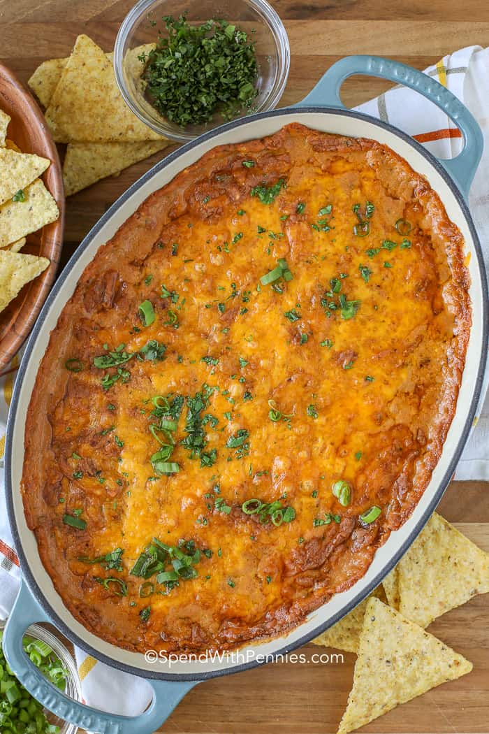 Creamy, cheesy and delicious this easy bean dip recipe is going to become a go-to! Refried beans and cream cheese create the base of this dip while taco seasoning and a handful of chopped jalapenos add lots of flavor (and a little kick)! #spendwithpennies #beandip #refriedbeandip #easydiprecipe #appetizerrecipe #cheesydip