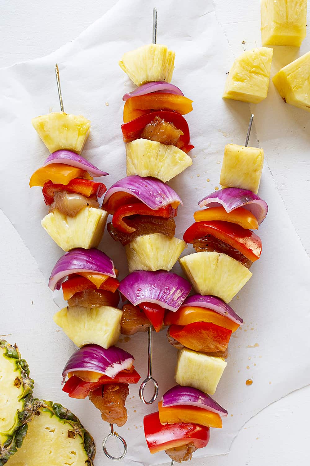 Hawaiian Chicken Kebabs will be the highlight of your summer! #hawaiianchicken #chicken #kebabs #kebabrecipes #chickenkebabs #chickenandpinneapple #chickenskewers #iambaker #summergrilling #kebabrecipes