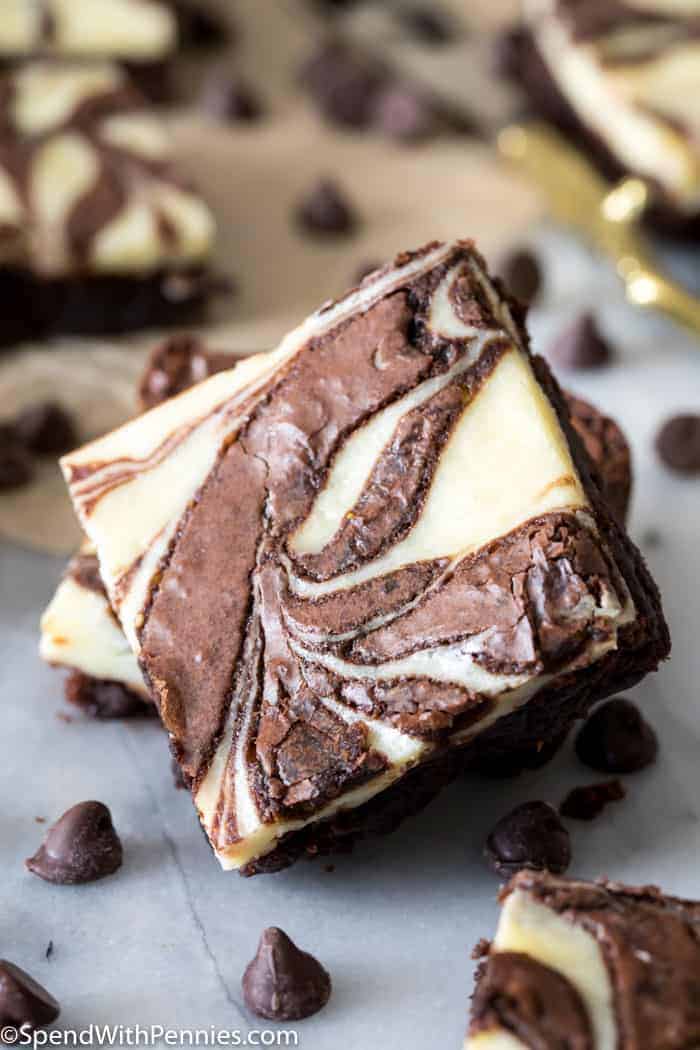 A propped-up square of fudgy cream cheese swirled brownies