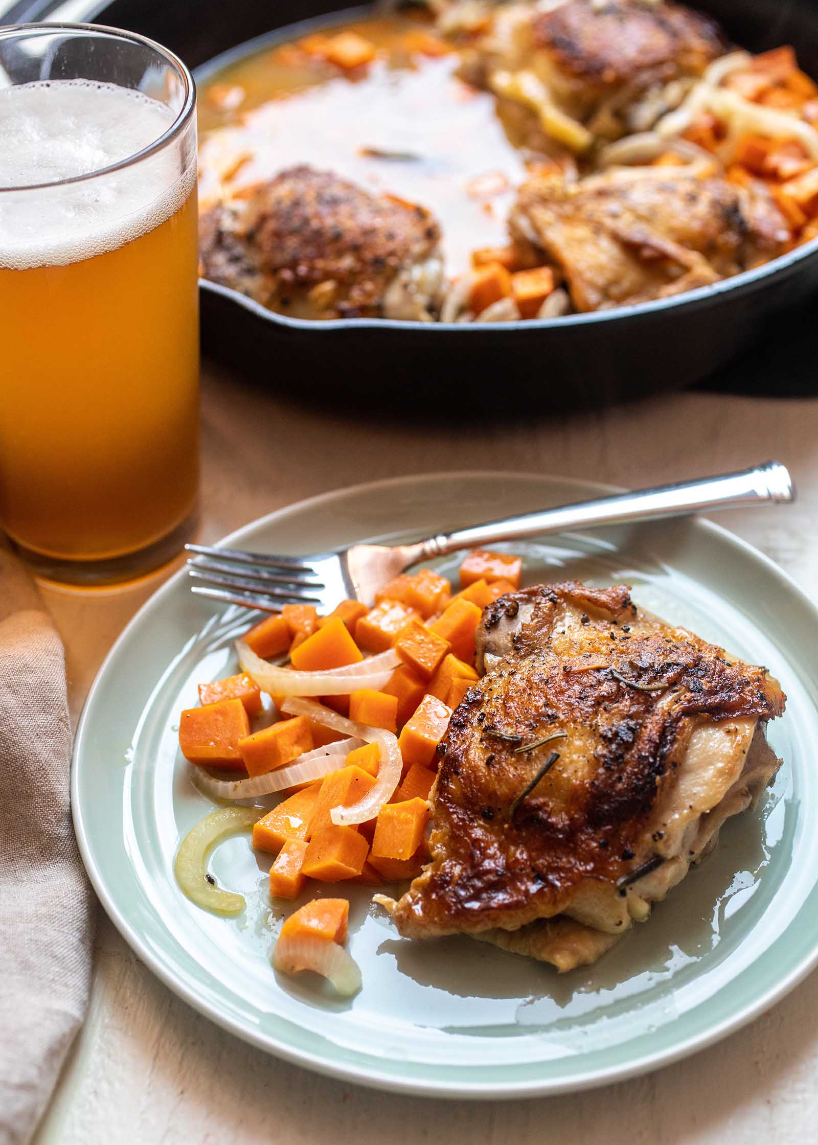 Weeknight one-pot skillet dinner cider-braised chicken thighs with sweet potatoes