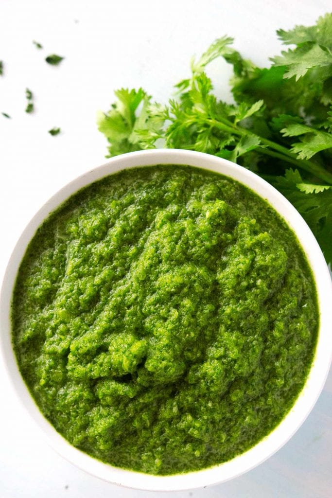 Sofrito is the main ingredient in many Latin caribbean dishes. It's super easy to make with peppers, garlic, onion, cilantro, and culantro. Use to season/flavor rice, meat, beans, soups, stews, veggies, practically anything you want!
