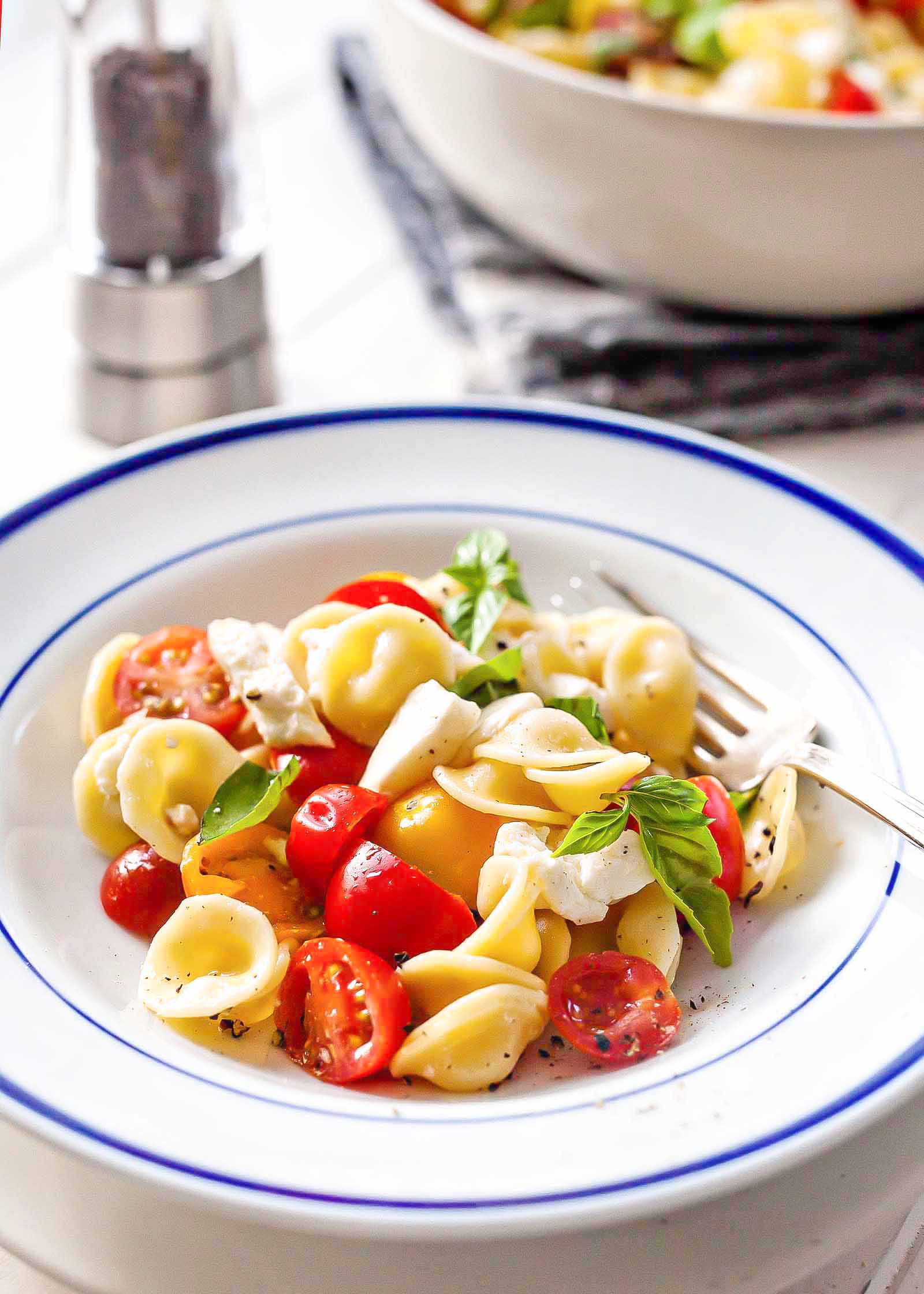 Caprese Salad with Cherry Tomatoes - bowl of caprese salad with pasta