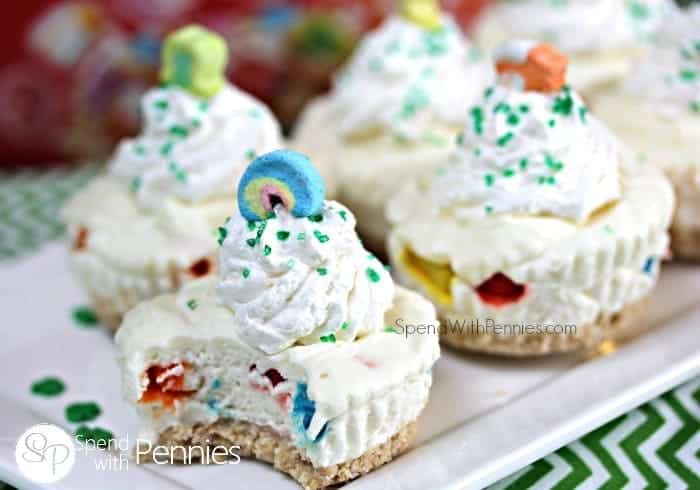 cheesecakes topped with lucky charms and sprinkles