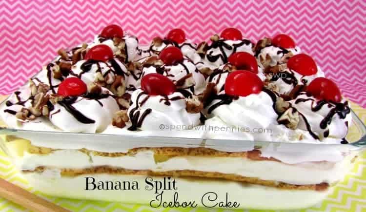 banana split ice box cake topped with whipped cream and cherries