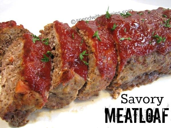 sliced meatloaf with sauce on top
