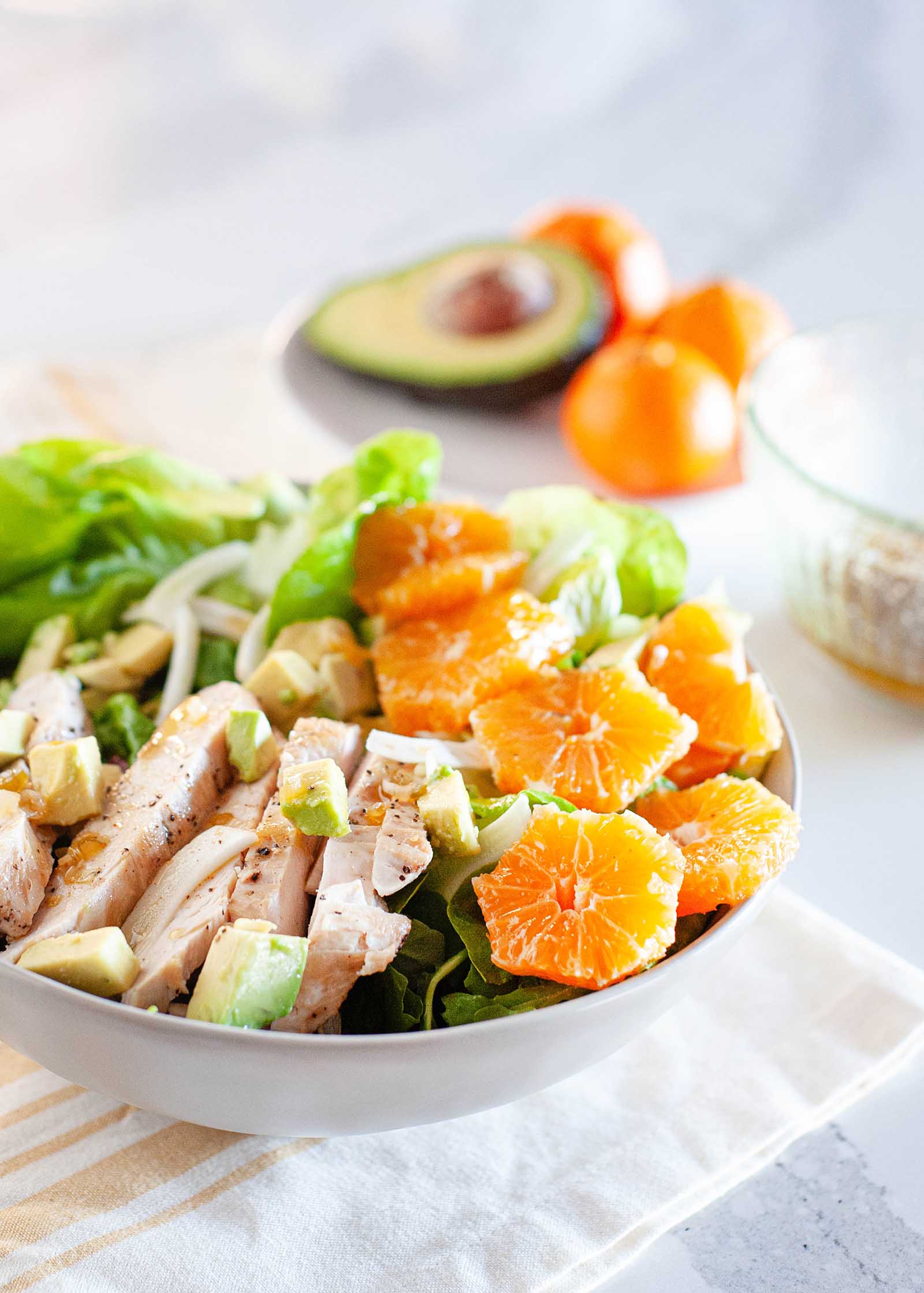 winter asian chopped chicken salad with mandarins and avocado