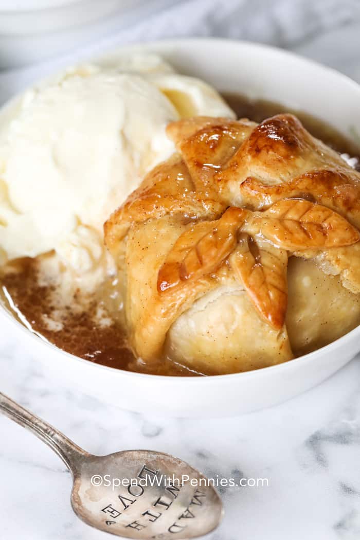 Apple Dumpling in a bowl with ice cream and a spoon