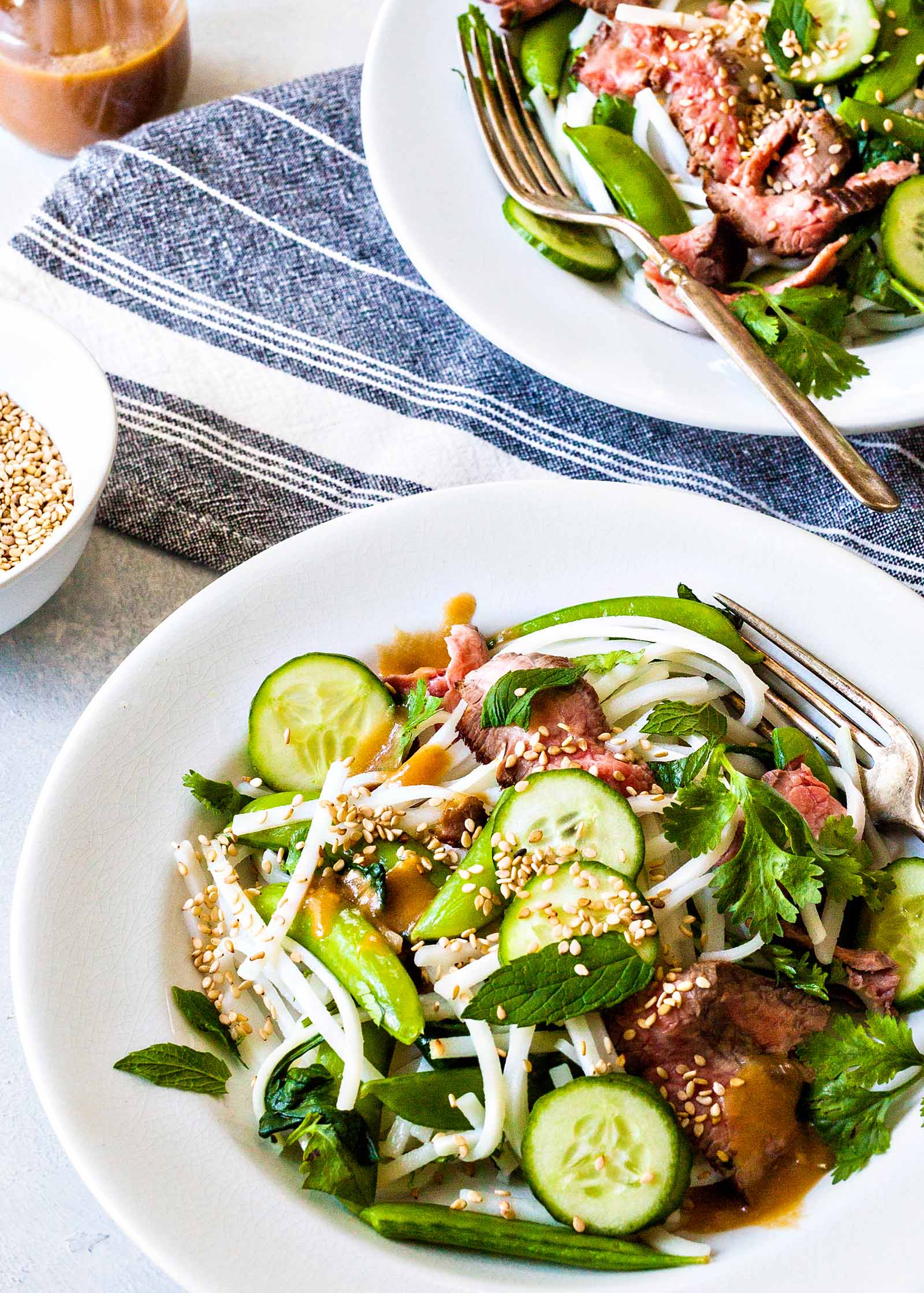 Beef Noodle Bowl - noodle salad with beef and vegtables in a white bowl