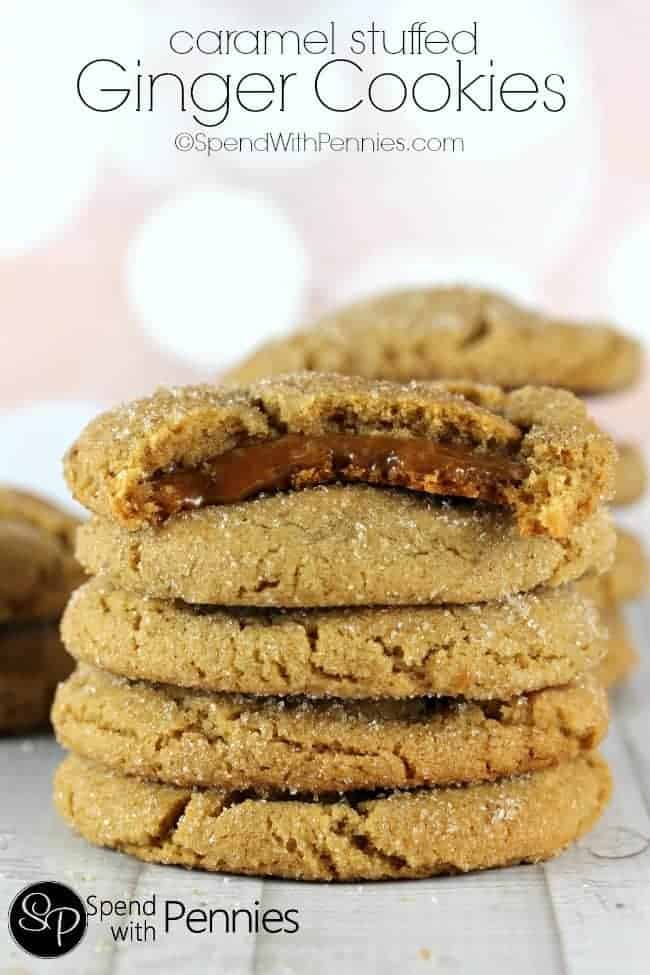 Caramel Stuffed Ginger Cookies in a stack with a bite out of the top one