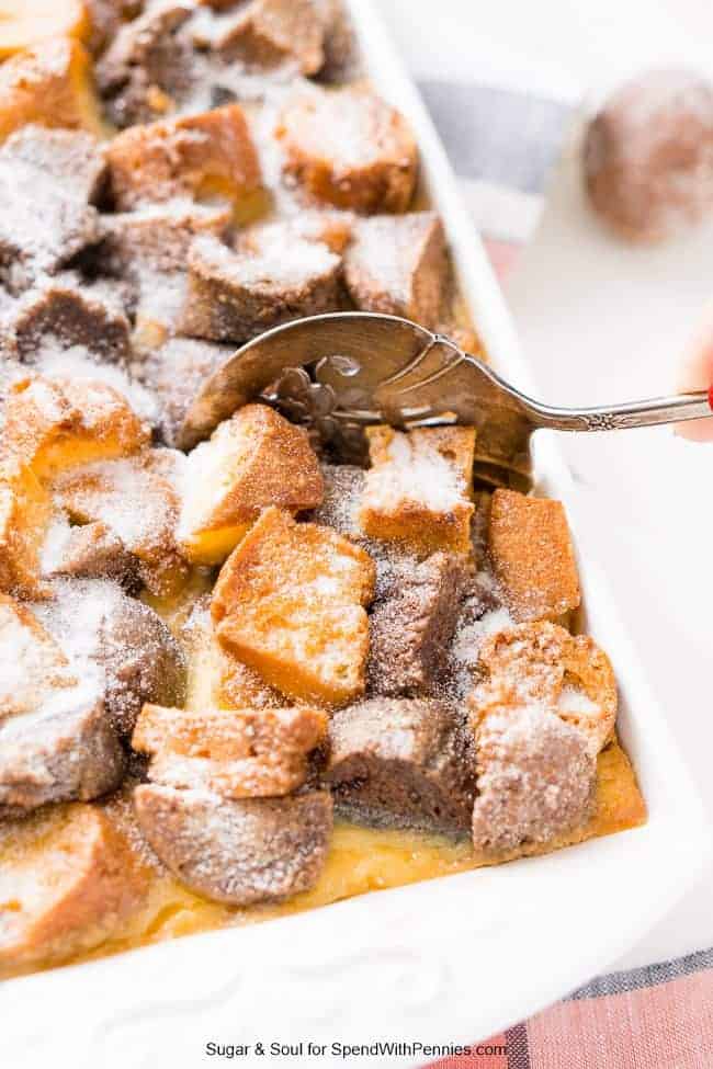 dishing up cake donut bread pudding from the baking dish