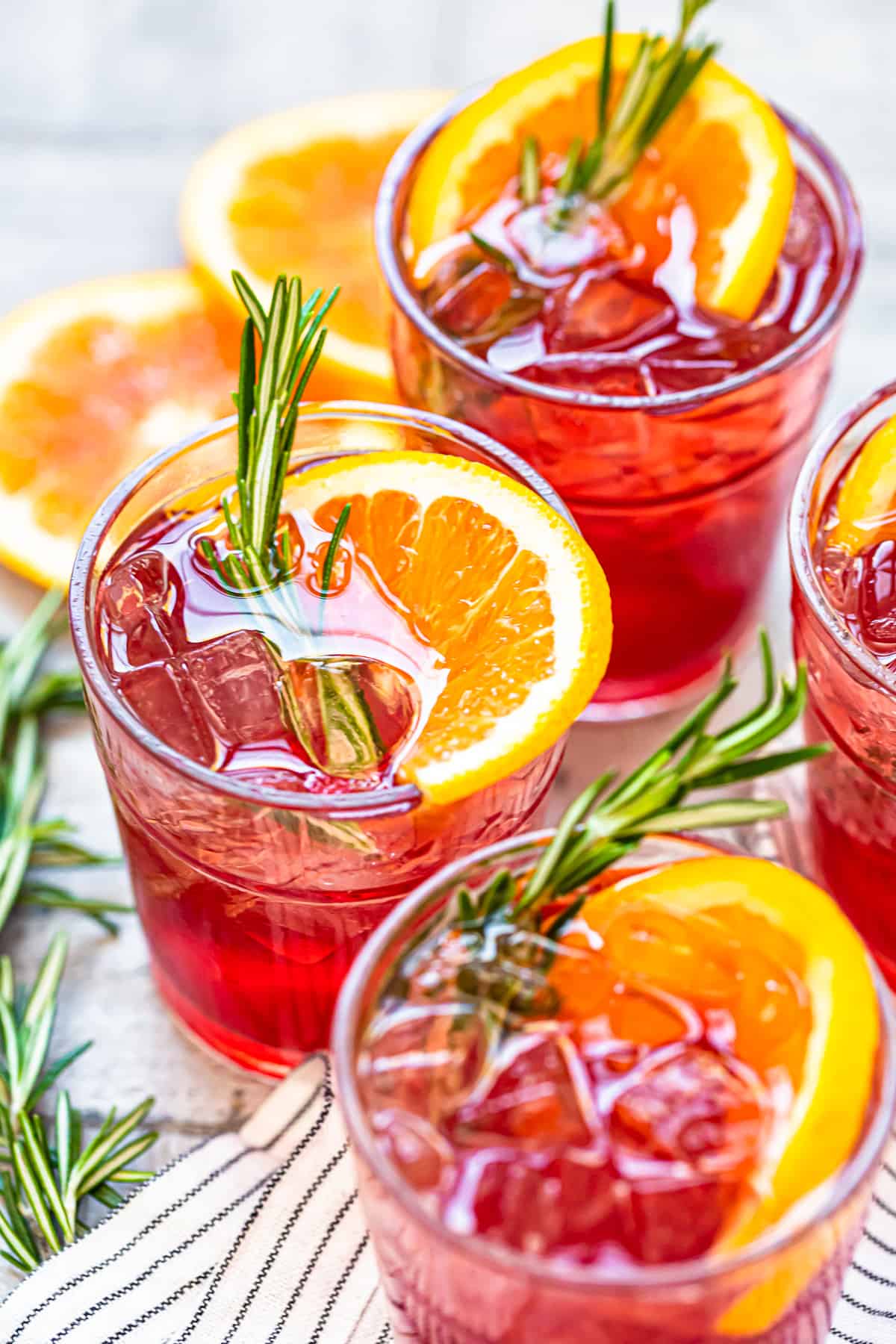 orange cranberry bourbon smash cocktails in glasses