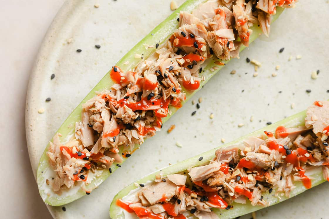 Spicy tuna cucumber boats on a plate.
